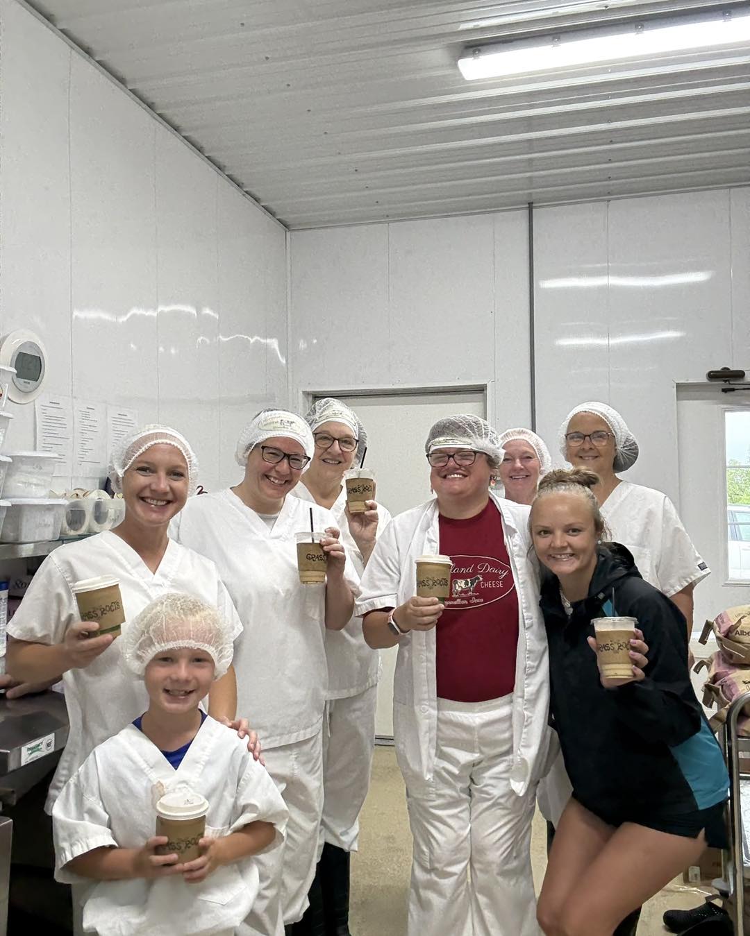 People at a dairy with cups of ice cream